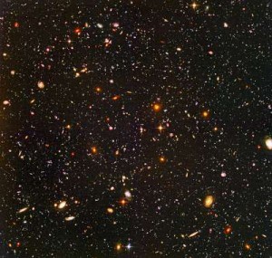A HUBBLE SPACE TELESCOPE IMAGE OF SOME OF THE EARLIEST GALAXIES THAT MAY HAVE BEEN RESPONSIBLE FOR ‘LIGHTING UP’ THE COSMOS. CREDIT: NASA, ESA, R. WINDHORST (ARIZONA STATE UNIVERSITY) AND H. YAN (SPITZER SCIENCE CENTER, CALTECH).